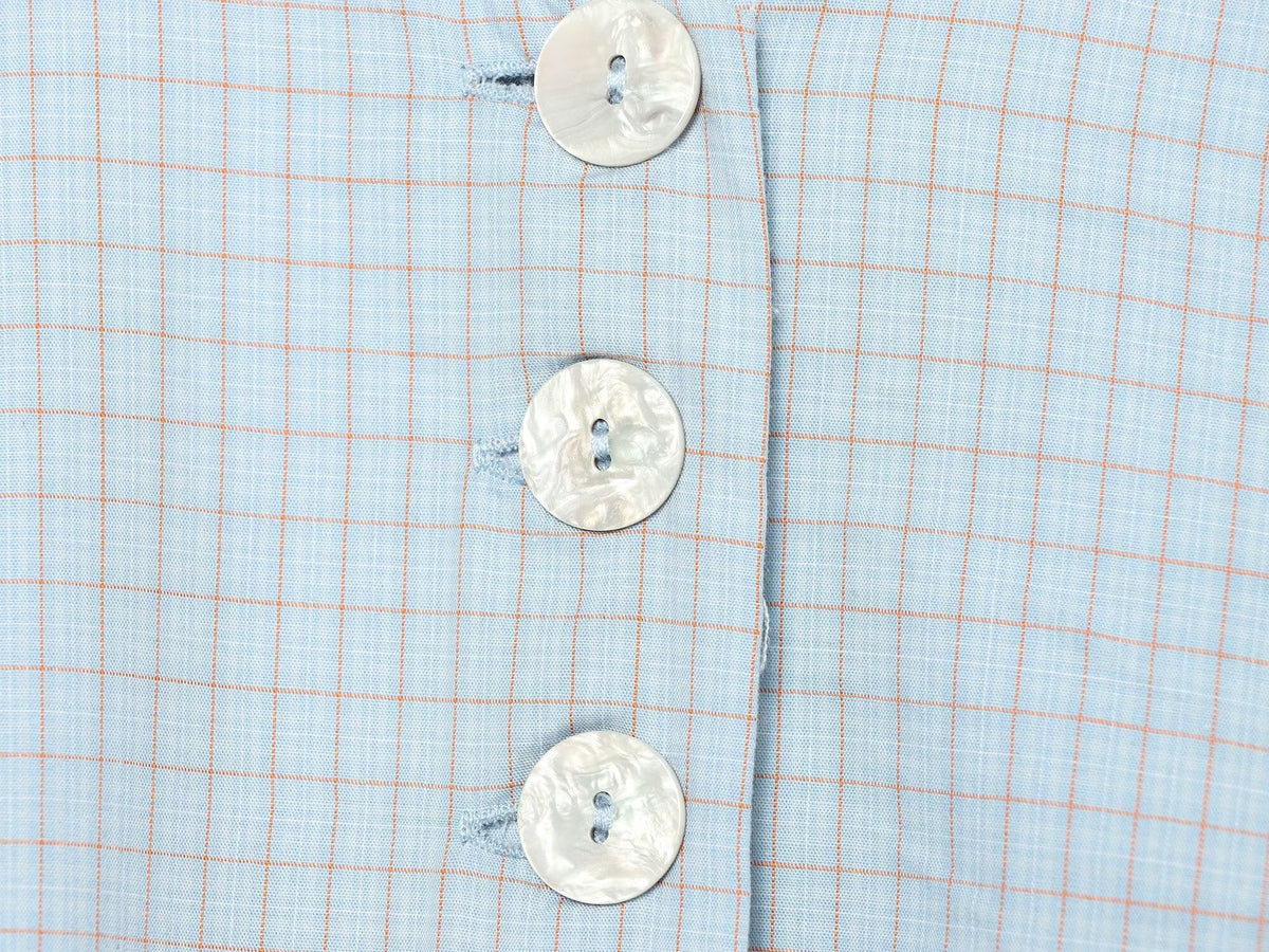 Women's short skirt style hem plaid top